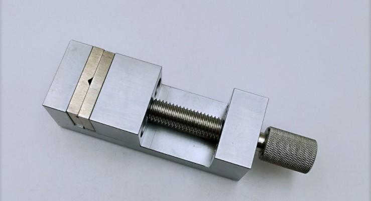 Small stainless steel vise tool for jeweler's watch and watch