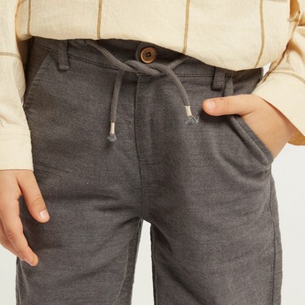 Solid Woven Pants with Pocket Detail and Button Closure