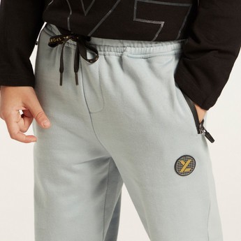 XYZ Textured Pants with Drawstring Closure and Zipper Pockets