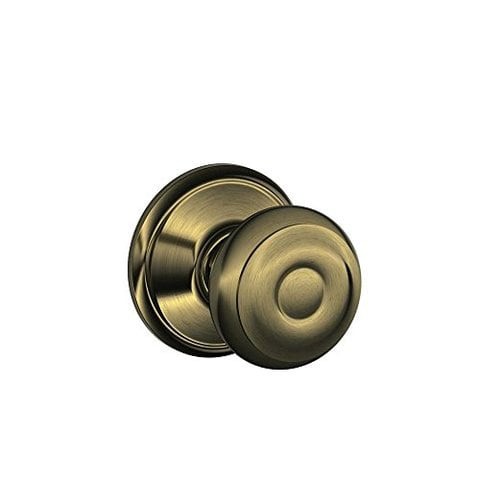 SCHLAGE Georgian Knob Hall And Closet Lock In Antique Brass